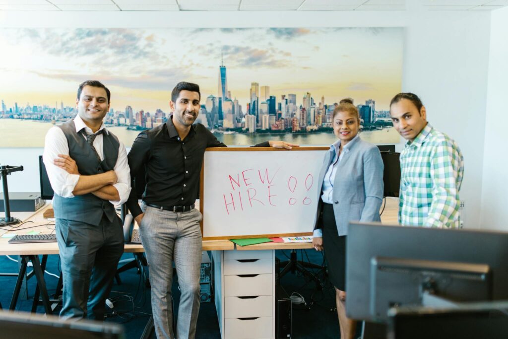 People Standing Beside a Whiteboard